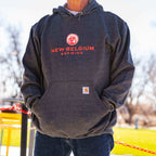 Man wearing New Belgium x Carhartt hoodie with his hands in the front pocket