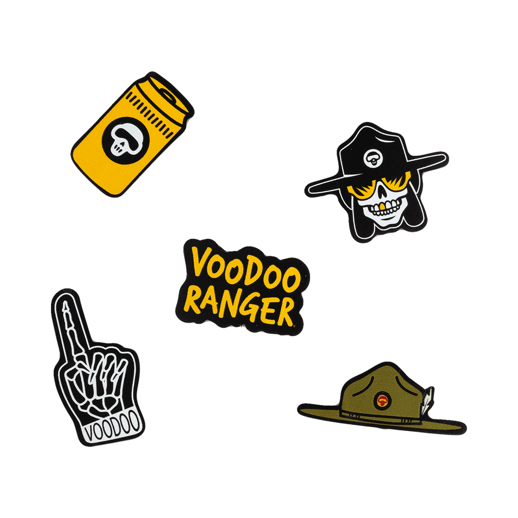 The five Voodoo Ranger Jibbitz: a yellow beer can, the Voodoo Ranger character head, a skeleton foam finger, the Voodoo Ranger wide-brimmed hat, and the Voodoo Ranger logo. 