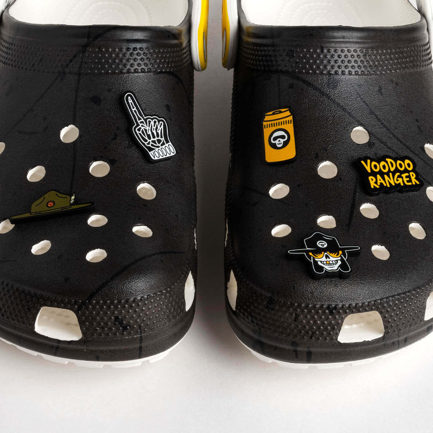 The five Voodoo Ranger jibbitz shown on two black Crocs