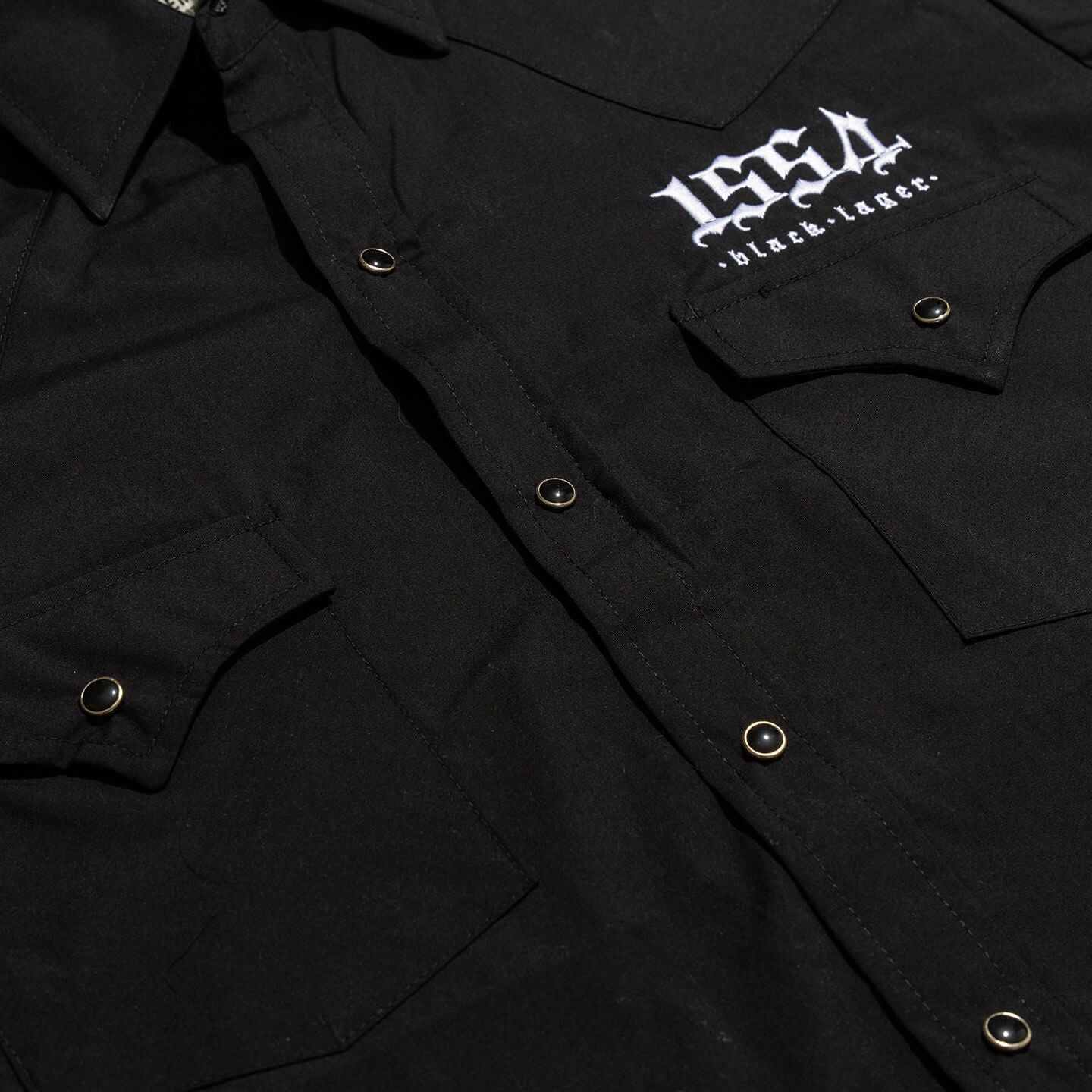 nbb 2026 merch black button up 3