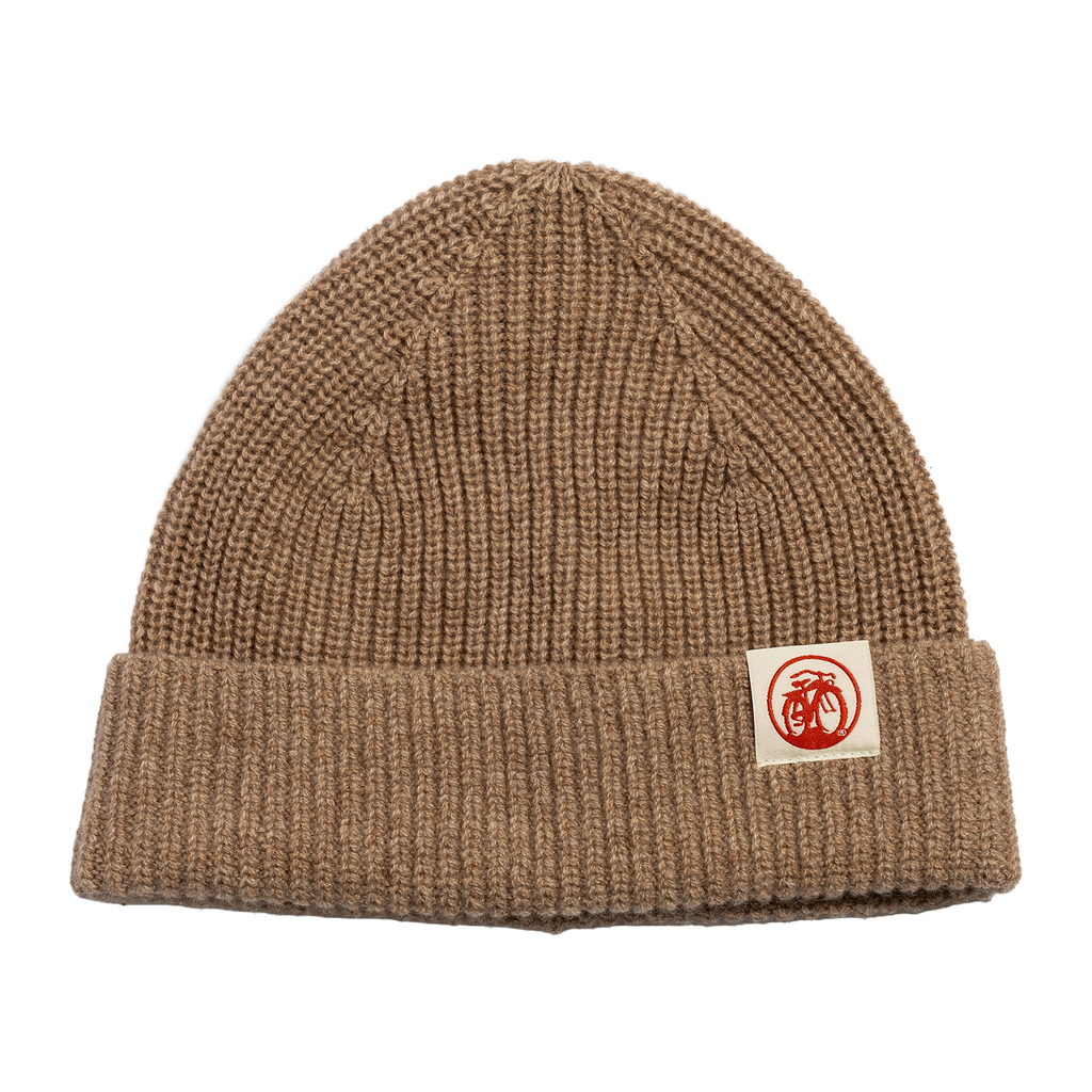 front view of oatmeal colored knit cashmere beanie with small New Belgium bike logo tag sewed to cuff