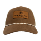 front view of a brown canvas trucker hat with a white rope detail across front brim and a leather patch of New Belgium Brewing with a bike on the front
