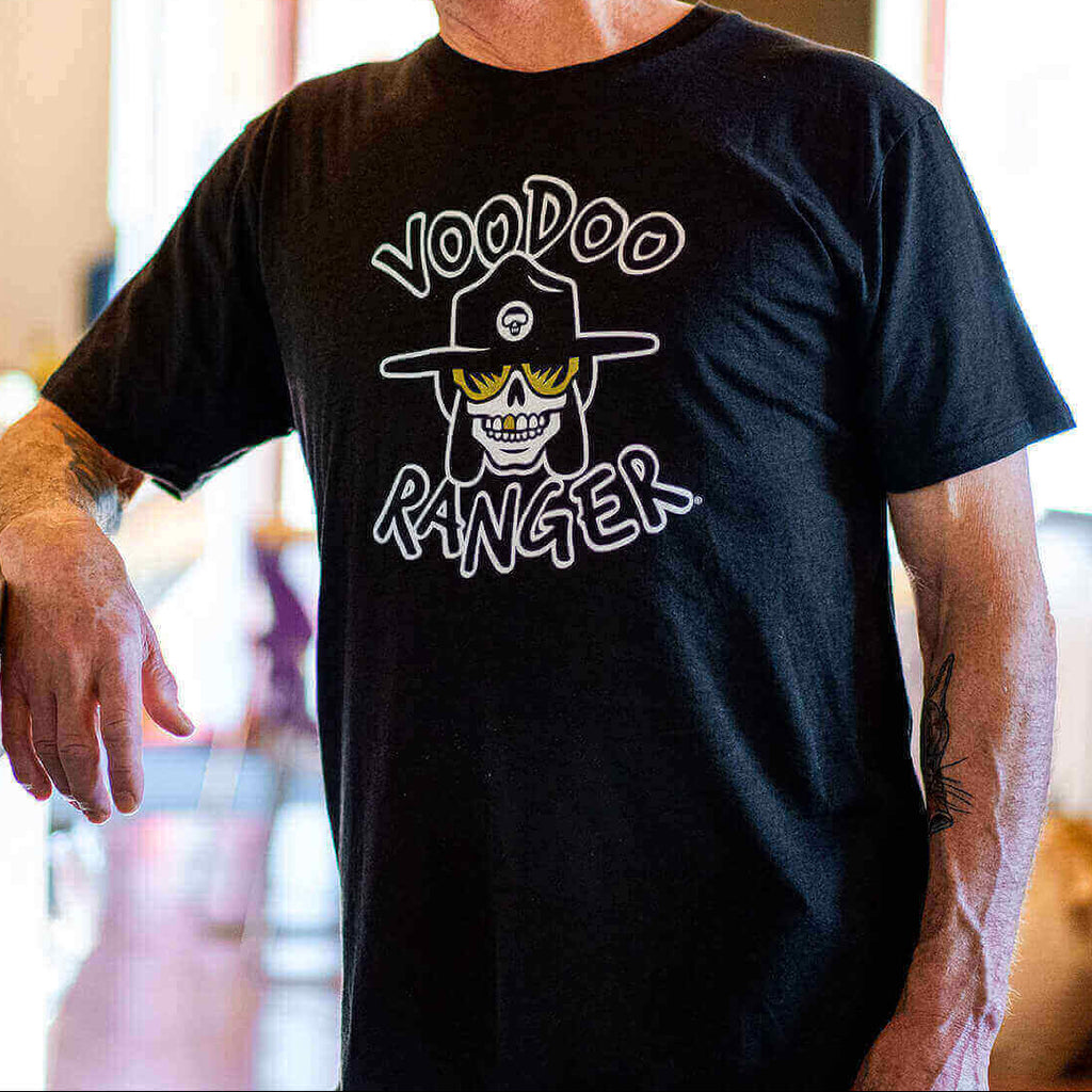 Man wearing t-shirt. It has a relaxed fit and mid-length short sleeves. 