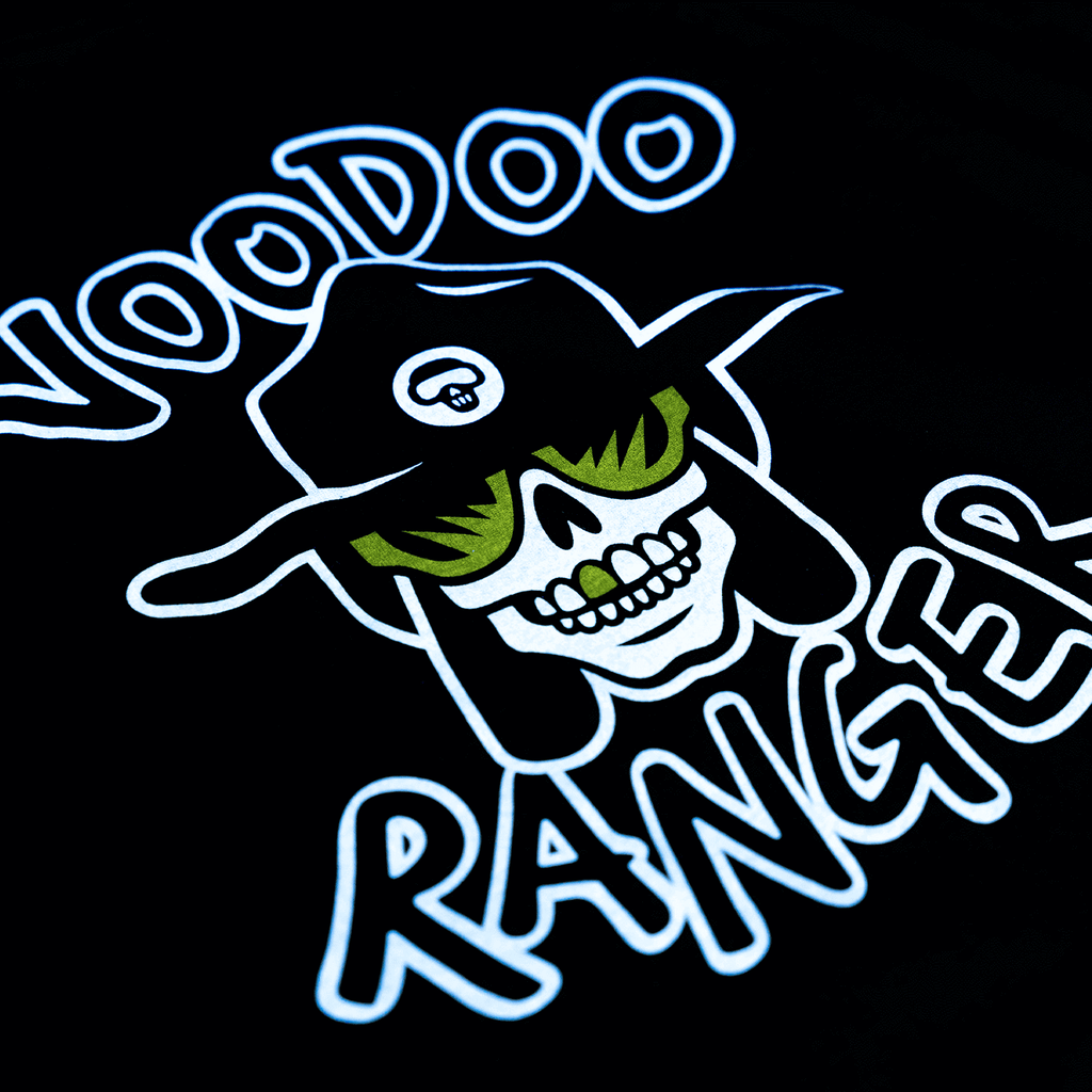 Close-up of the logo that is laser-printed on the shirt. Voodoo Ranger has yellow glasses on and one yellow front tooth. 