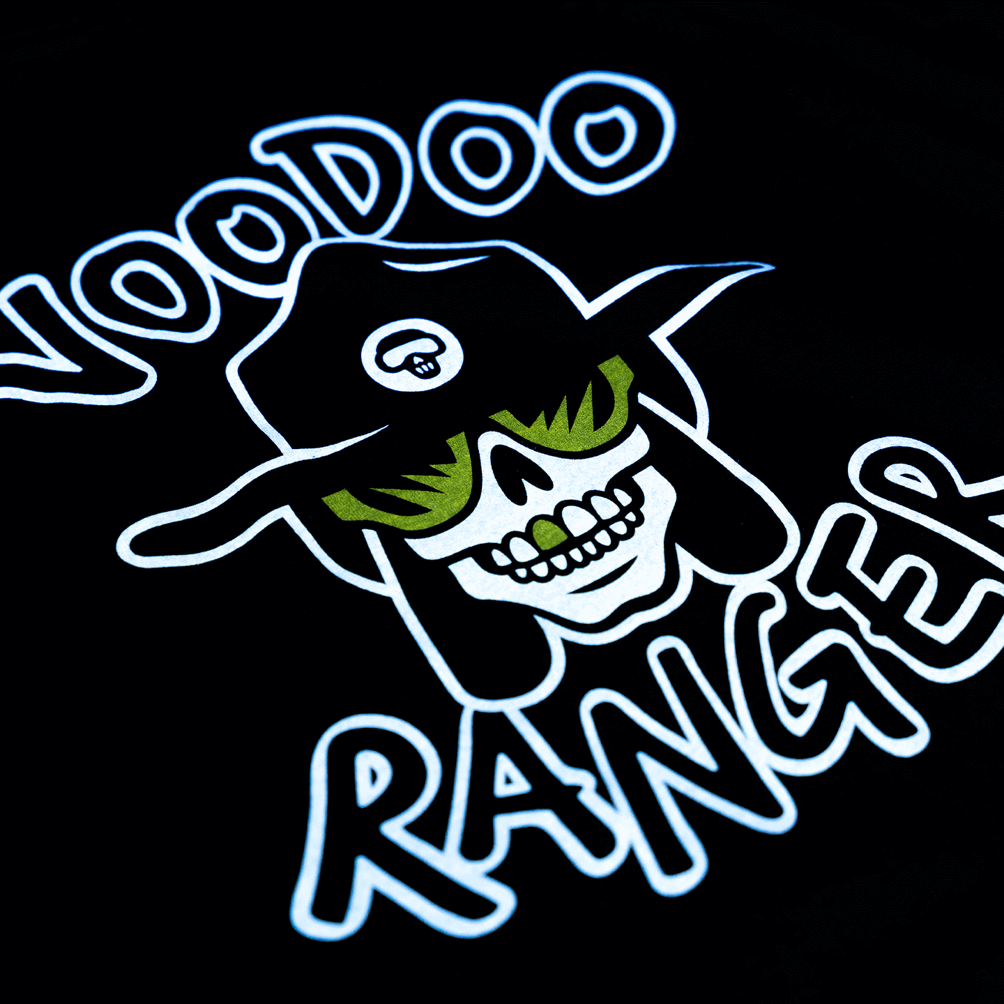 Close-up of the logo that is laser-printed on the shirt. Voodoo Ranger has yellow glasses on and one yellow front tooth. 